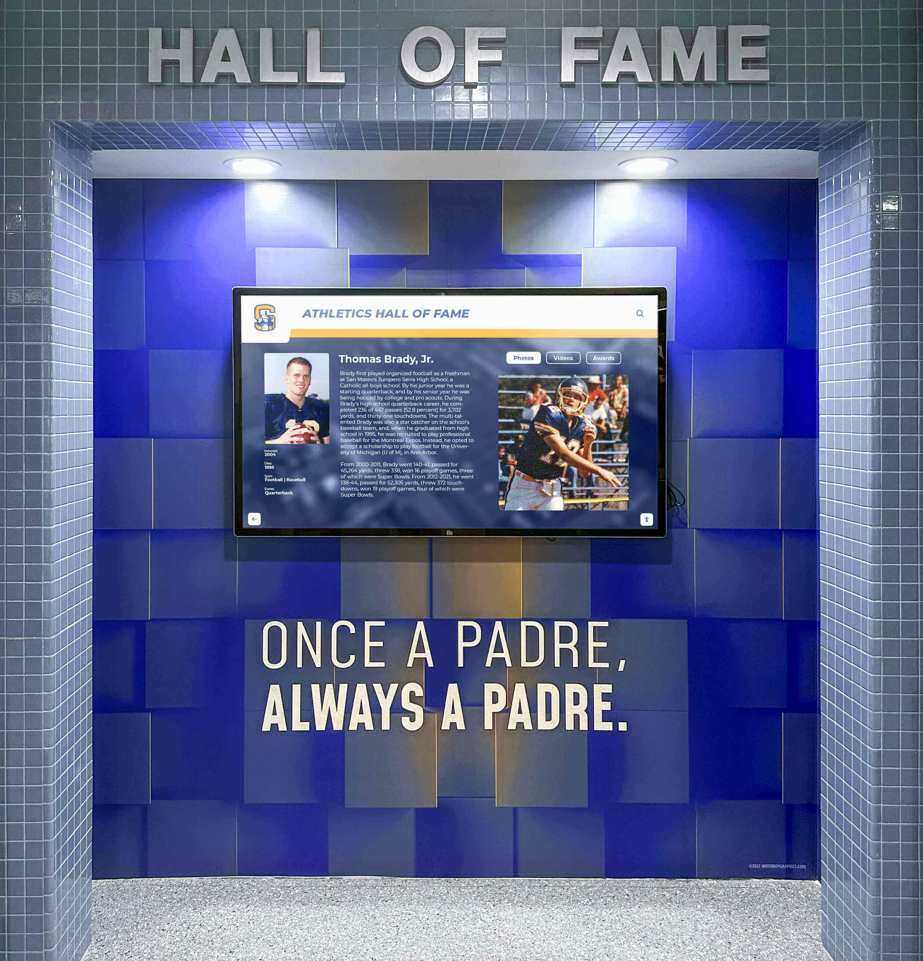 Athletics hall of fame digital screen mounted on blue tiled wall