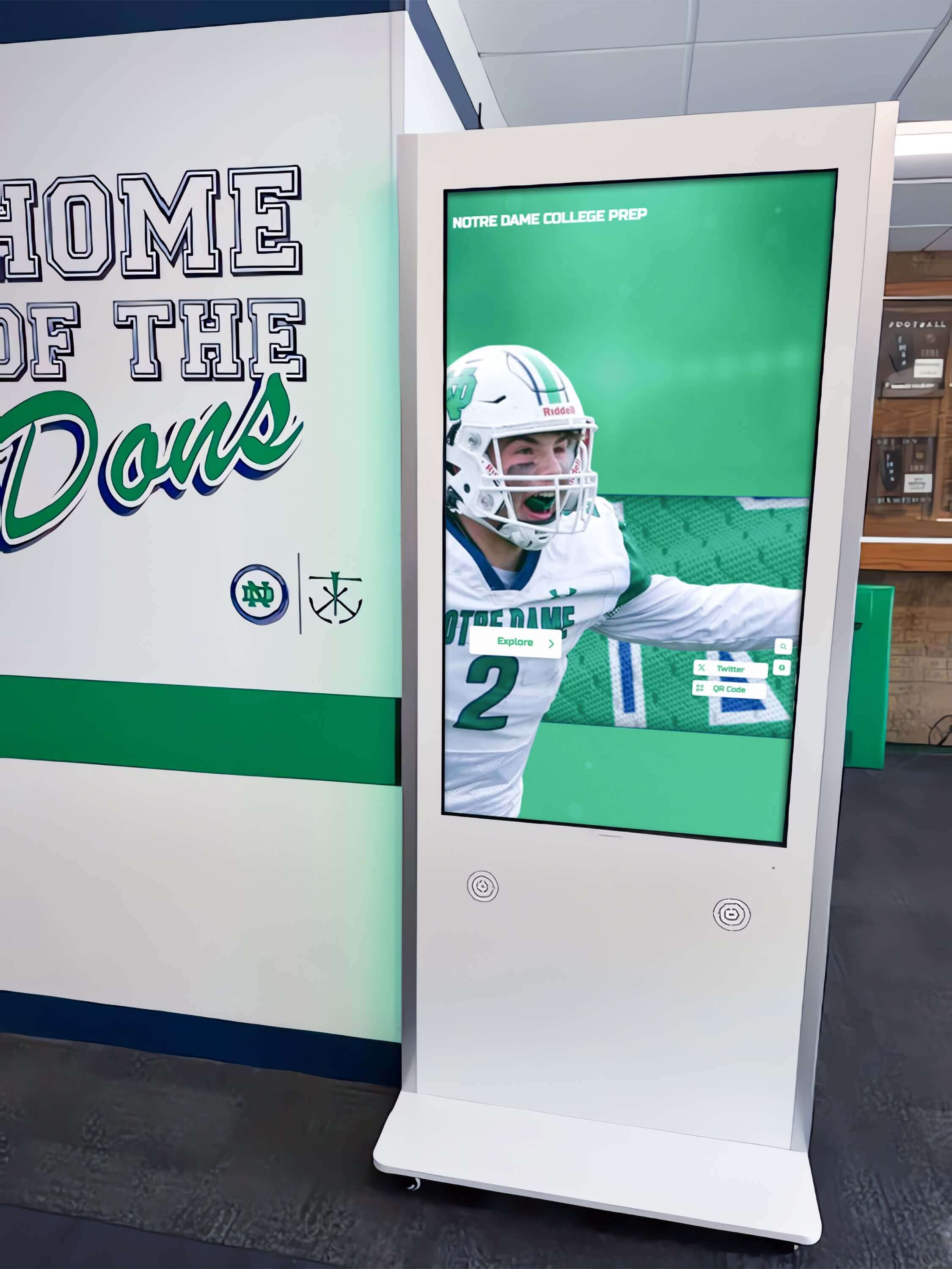 Interactive kiosk in hallway displaying Notre Dame College Prep football achievements
