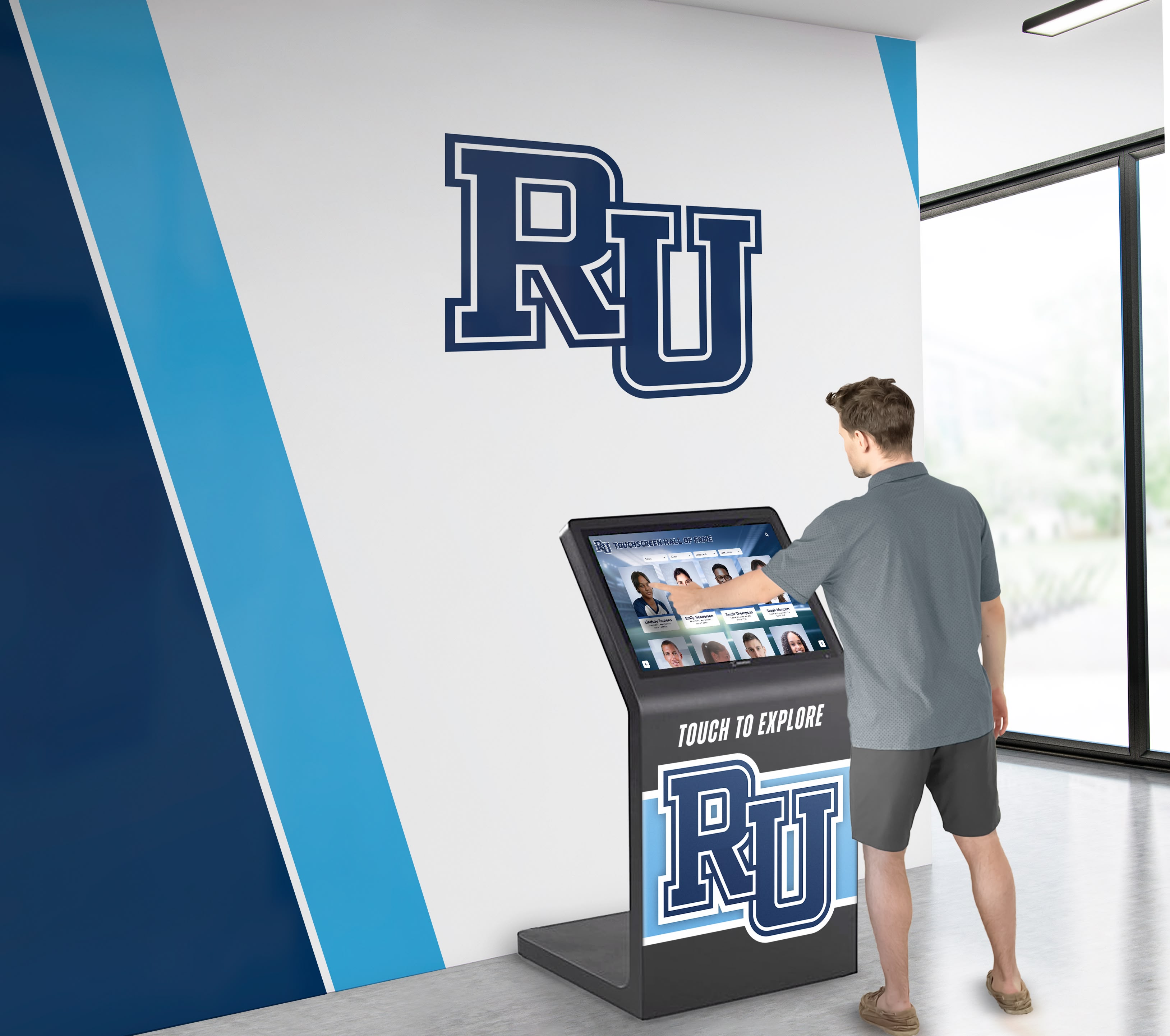 Person using Rocket Alumni touchscreen kiosk in university campus lobby